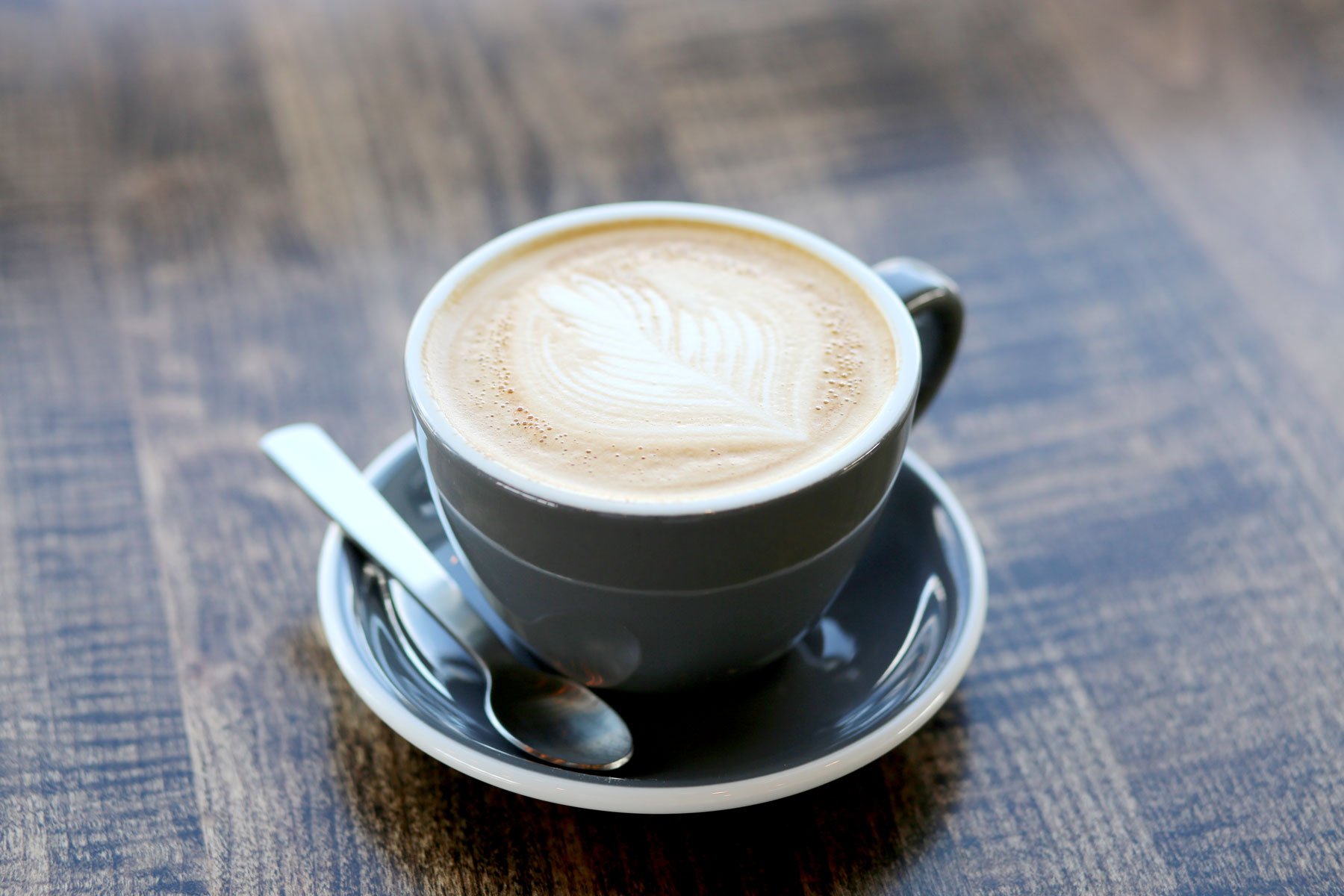 Latte with rosetta art at Wild Roots Coffee House